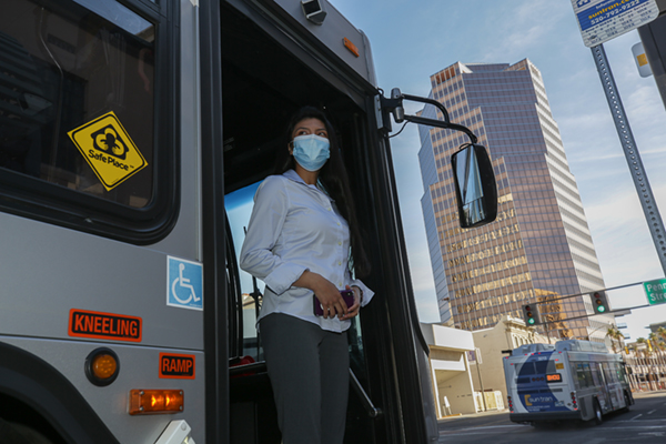 person existing a suntran bus