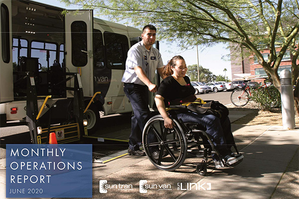 report cover driver pushing rider in a wheelchair