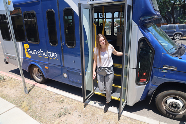 woman exiting sunshuttle