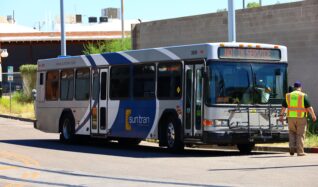 Sun Link Safety Officer Ryan Landry walks towards a Sun Tran bus during a training exercise.