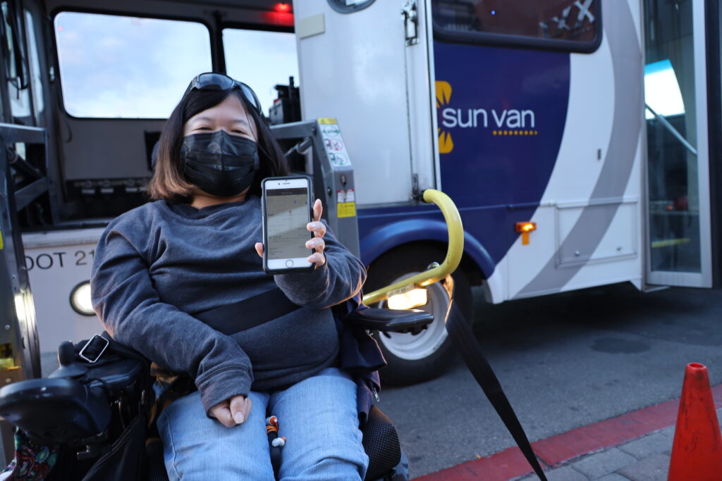 Client Amanda Parkman shows the Sun Van app on her smartphone.