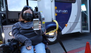 Client Amanda Parkman shows the Sun Van app on her smartphone.