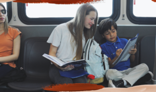 Student riders doing homework while on a Sun Tran bus.