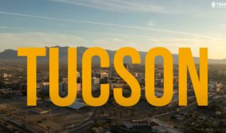 Photo of the city of Tucson with yellow lettering.